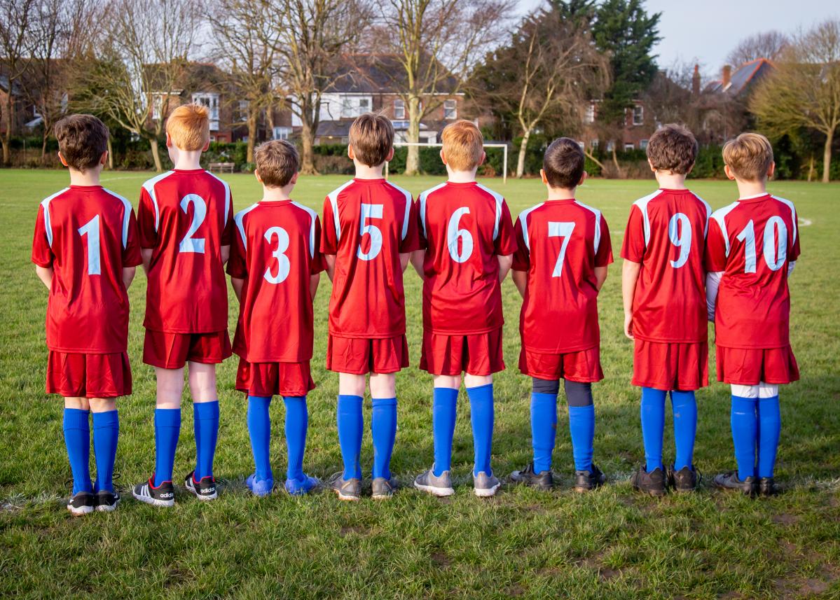 Pupils in PE Kit standing in numbered order